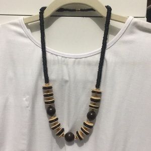 Brown, cream and black wooden beads and discs